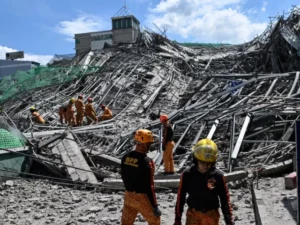 Rescuers search for more than 20 trapped after Philippines building collapse